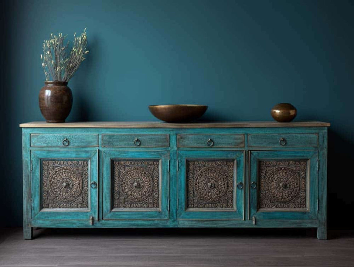Turquoise patterned buffet with four framed front panels, shown in a straight-on front view against a dark wall.