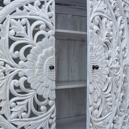 Two door carved sideboard in rustic wood, open door view revealing interior shelves and floral carvings.