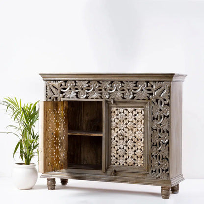 Two door floral cupboard in natural wood, angled front view with the left door open, showing its shelf and right side.