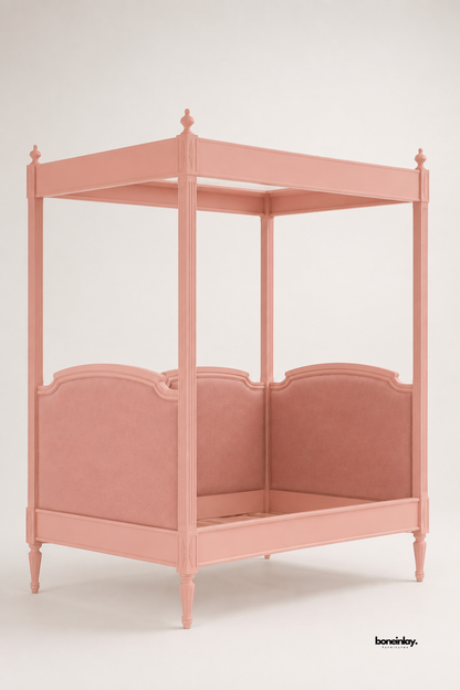 Handmade pink wooden four-poster canopy day bed presented in a clean studio setting, highlighting its fluted posts, tapered legs, and fully upholstered panels. This elegant statement piece delivers refined comfort and luxury artisan craftsmanship for contemporary bedrooms.