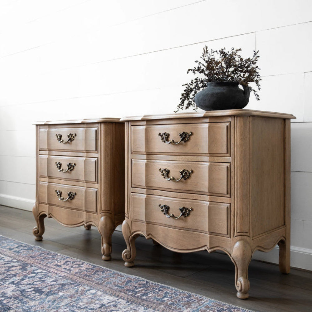 Walnut scalloped edge nightstand in rich brown finish, shown in a side profile view against the wall.