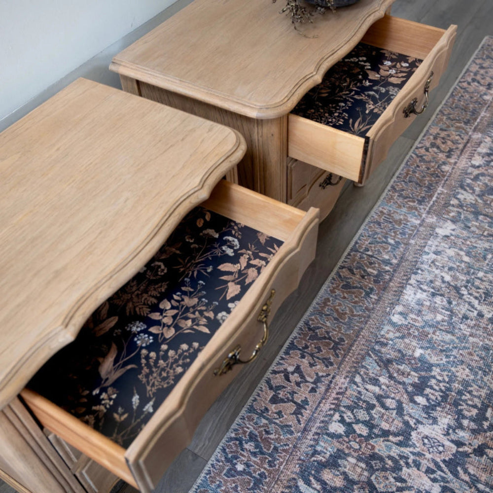 Walnut two-drawer storage chest with bottom drawer pulled open, shown in an open drawer view.