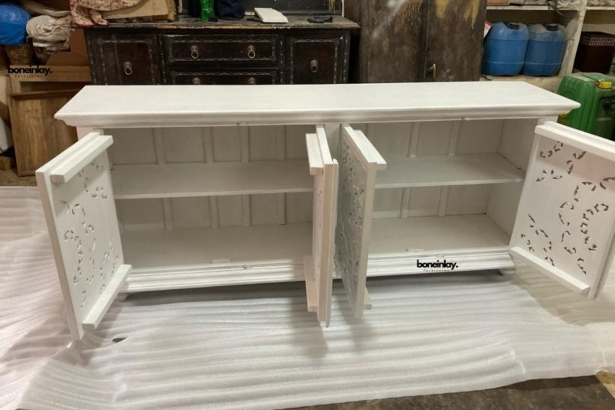 White floral door credenza in an open cabinet view, with doors swung outward to reveal the storage space.