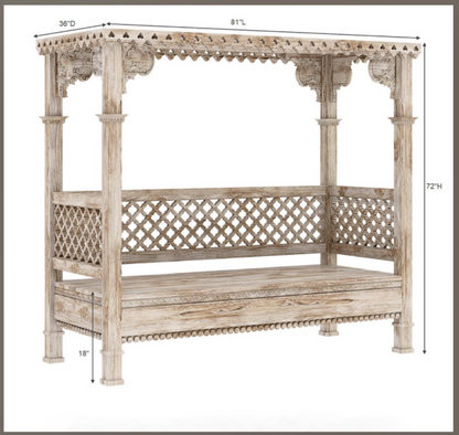 A luxury hand-carved solid wood canopy daybed with a whitewash finish, decorative scalloped cornice, and lattice-work backrest panels.