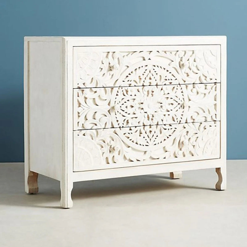 Whitewashed solid wood lowboy with three drawers and carved fronts, presented as another view of the Lombok piece.