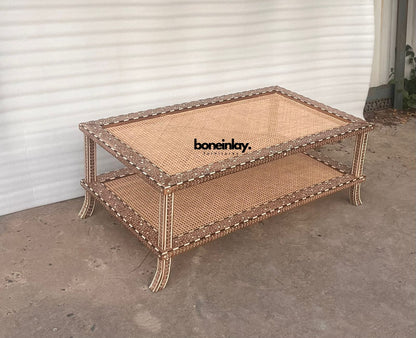 Rectangular two-tier wooden coffee table featuring floral bone inlay borders, natural woven rattan cane shelves, and curved legs.