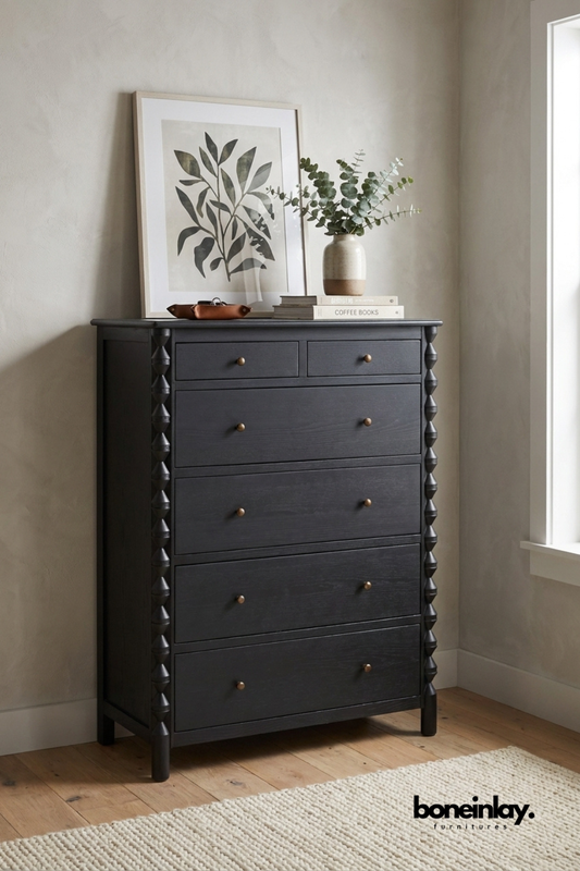 Black solid wood tall chest of drawers with turned spindle side detailing, six spacious drawers, brass knobs, and handcrafted bedroom storage furniture in a modern classic design.