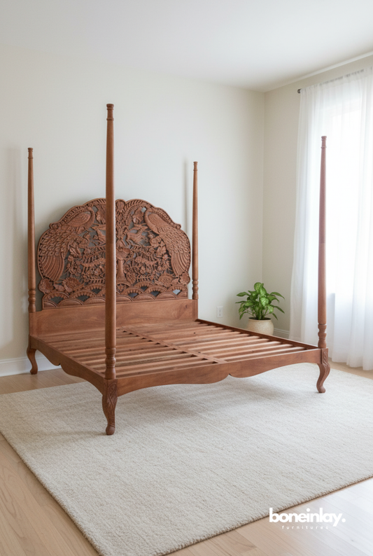 A hand-carved solid wood four-poster bed in a bright bedroom, featuring an intricate peacock relief carving on the headboard and a warm natural wood finish.