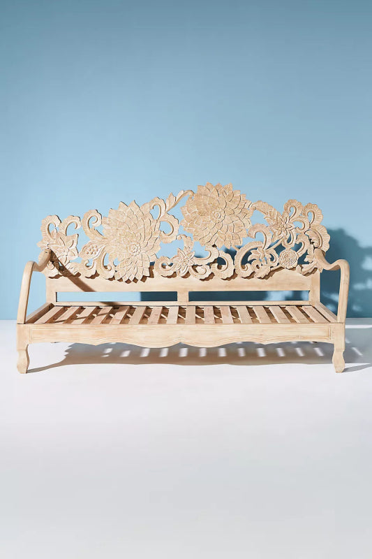 Solid wood Lotus daybed with a sculptural flower-shaped backrest.