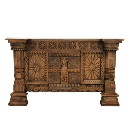  Antique brown wooden credenza with carved floral panels, geometric trim, and chunky column legs, shown from the front.