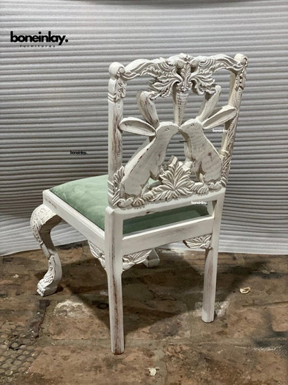 back side of white menagerie chair 