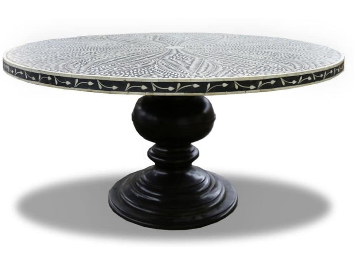  Black round bone inlay dining table with an ivory leaf-patterned top and sculpted pedestal base.