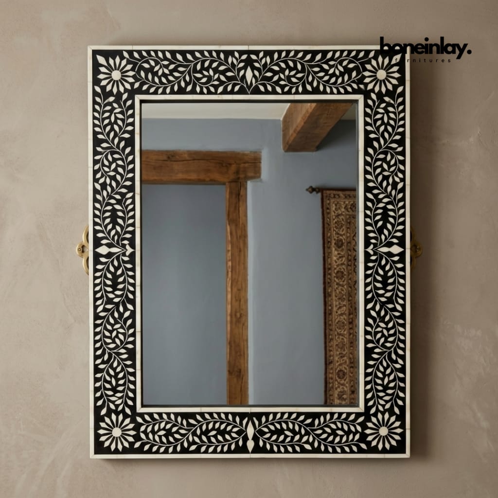 Rectangular black and white bone inlay wall mirror with floral leaf vine border and daisy corner motifs