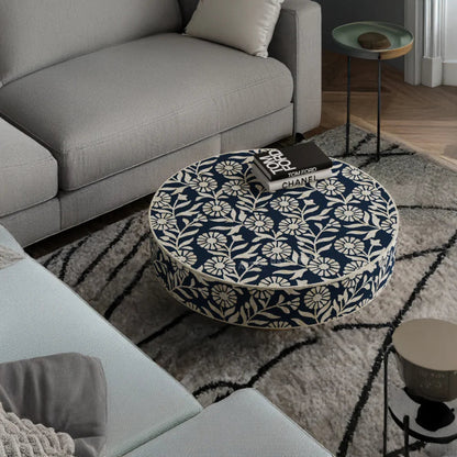 A round coffee table featuring the intricate Lalita navy blue and white floral bone inlay pattern, styled in a modern living room setting.
