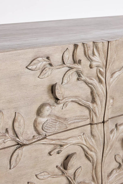 Brass ring pull hardware on hand-carved Ornithology solid wood drawer dresser