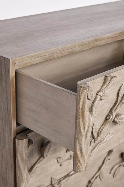 Ornithology six drawer dresser styled in luxury master bedroom with bird branch carving and natural wood finish