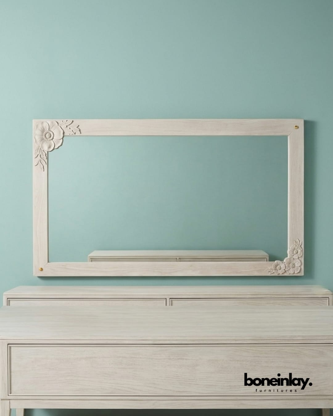 Large rectangular wall enchantment mirror featuring hand-carved floral corner flourishes in a distressed white finish.