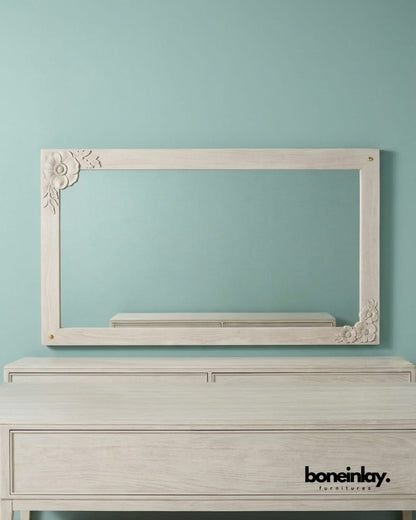 Large rectangular wall enchantment mirror featuring hand-carved floral corner flourishes in a distressed white finish.