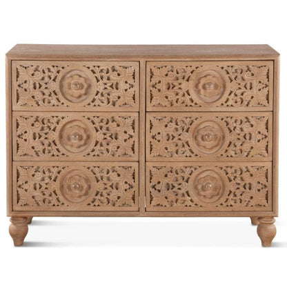 Front view of a 6-drawer natural mango wood dresser with hand-carved floral mandala patterns on drawer fronts and traditional bun feet.