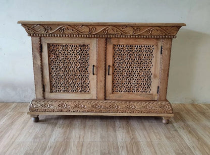 Hand-carved solid wood sideboard featuring two doors with star-patterned lattice fretwork and ornate floral vine relief carvings in a natural finish.