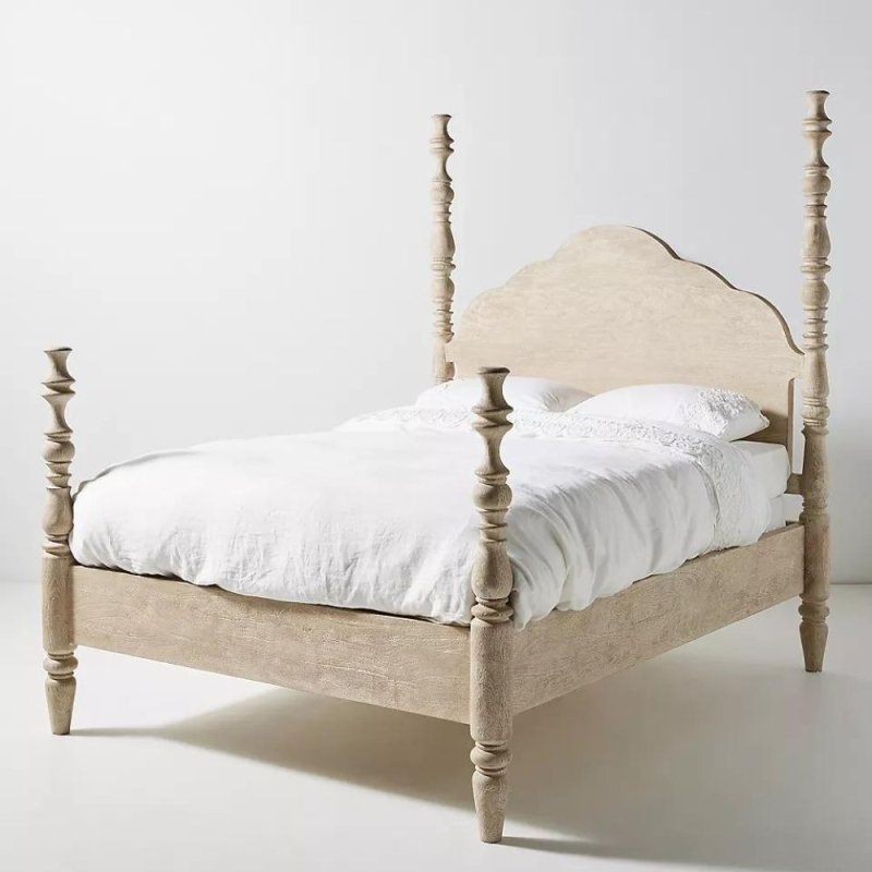 Solid wood Rosalie spindle platform bed with decorative hand-carved details and a timeless four-poster frame.