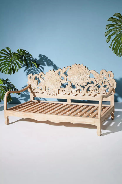 Lotus wooden daybed with a large hand-carved flower forming the backrest.