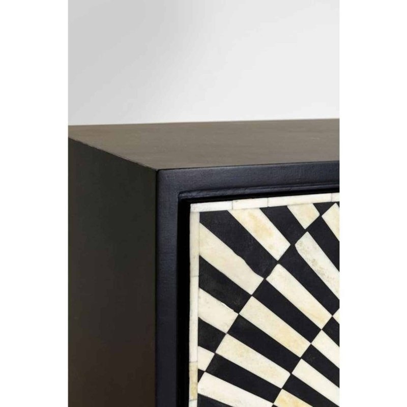Close detail of handmade black and ivory bone inlay optical pattern on bar cabinet corner showing intricate tile work and black mango wood frame