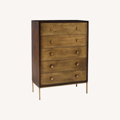 Manor five-drawer storage chest with handcrafted brass cladding and refined modern bedroom styling.