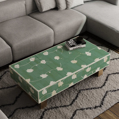 Handcrafted rectangular bone inlay coffee table in emerald green with white floral motifs and solid brass legs — premium artisan living room decor.