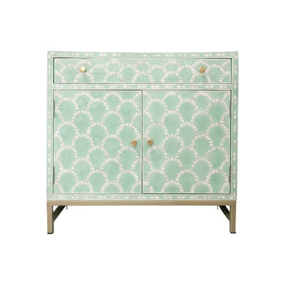 Seafoam blue and white bone inlay scalloped cabinet with one top drawer, two doors, and brass knobs on a gold metal base shown on white background