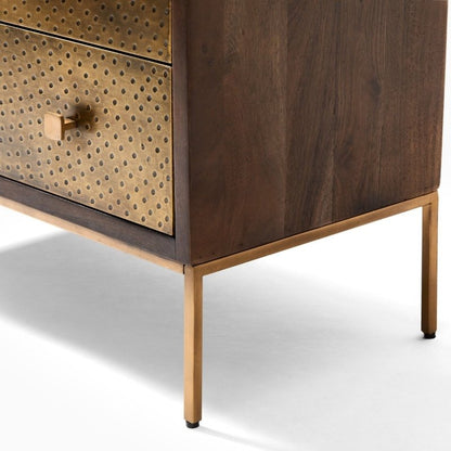 Solid wood chest of drawers finished with textured brass cladding and decorative brass knobs.