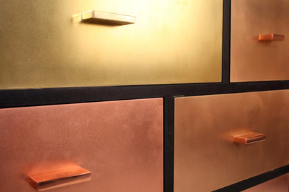 Black copper dresser with metallic sheen for bedroom decor