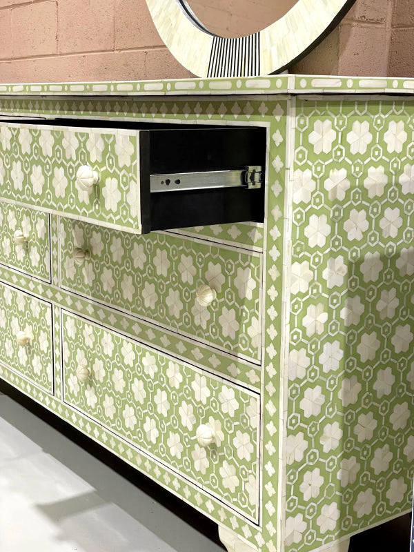 Sage green bone inlay seven-drawer dresser with clover floral motif, white knobs and decorative mirror on top