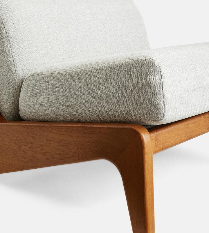 Handcrafted Fletcher armless chair combining a satin-finished hardwood frame with a supportive upholstered seat.