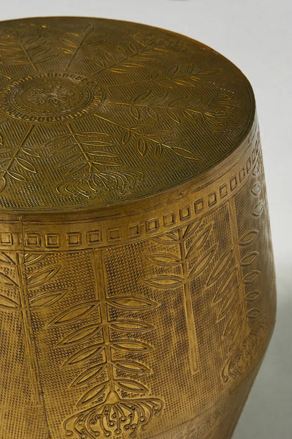 Modern rustic drum table with antique metal foil, blooming flower motifs, leafy vines, and a tapered profile.