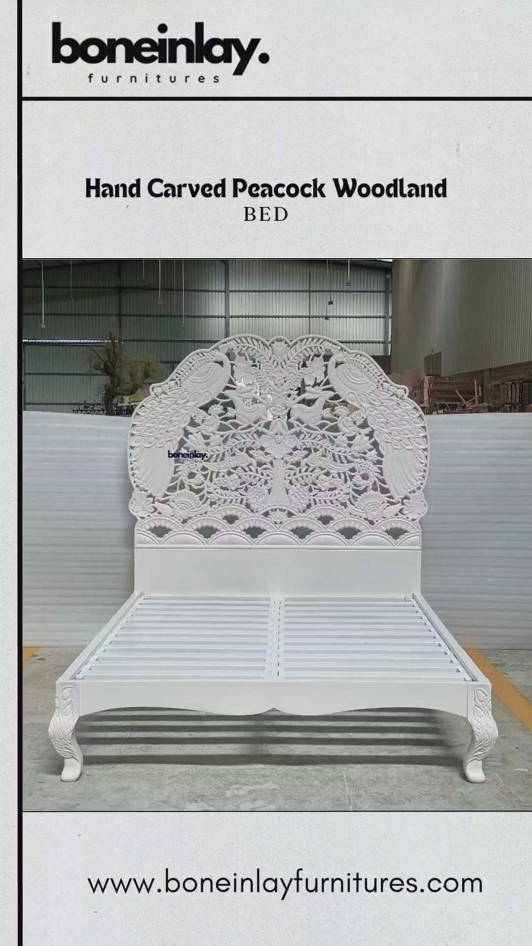 A grand, hand-carved solid wood bed frame finished in a pristine white satin. The monumental headboard features a high-relief "Peacock Woodland" scene, masterfully sculpted with intricate details of graceful peacocks, jumping rabbits, and songbirds amidst a lush canopy of blossoming trees and floral vines. The bed includes a robust slatted support system and elegant cabriole legs, each accented with delicate hand-carved leaf motifs. This artisanal piece highlights the depth and texture of traditional wood.