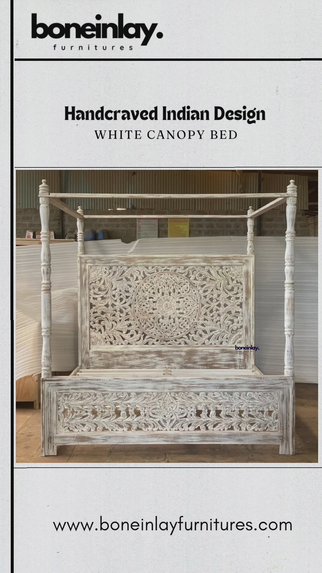 A factory video showcasing a hand-carved white canopy bed with a rustic farmhouse aesthetic. The design features an intricate floral mandala headboard and a coordinating footboard, all finished in a distressed "shabby chic" white paint. The video displays the solid wood construction, traditional Indian artistry, and four-poster frame, highlighting services like free worldwide delivery and customization.