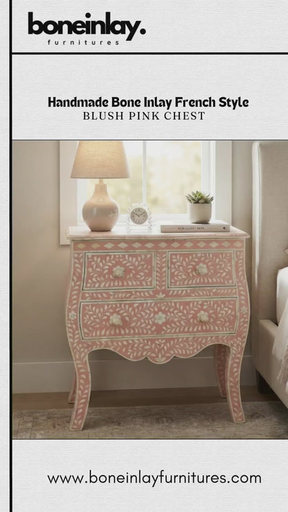 A French-style blush pink chest features intricate handmade bone inlay leaf and floral motifs across its top surface, front drawers, and elegant curved cabriole legs. The chest includes two small top drawers and two full-width bottom drawers adorned with matching inlay knobs