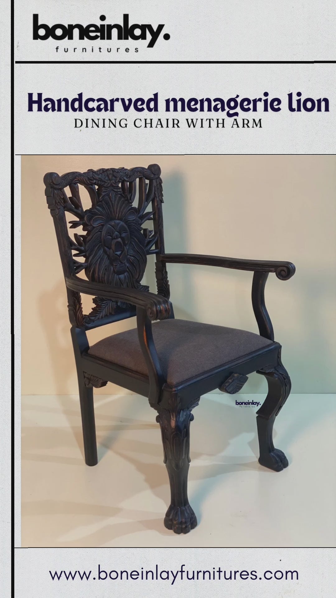 This video features a "Handcarved Menagerie Lion Dining Chair with Arm," showcasing a striking, hand-carved lion’s face as the centerpiece of the openwork backrest. The solid wood frame is finished in a deep, dark espresso tone that highlights the intricate artisanal textures, while the seat is upholstered in a smooth, charcoal gray fabric. Detailed close-ups emphasize the masterfully sculpted lion motif, elegant curved arms, and ornate cabriole legs, blending regal artistry with functional furniture design