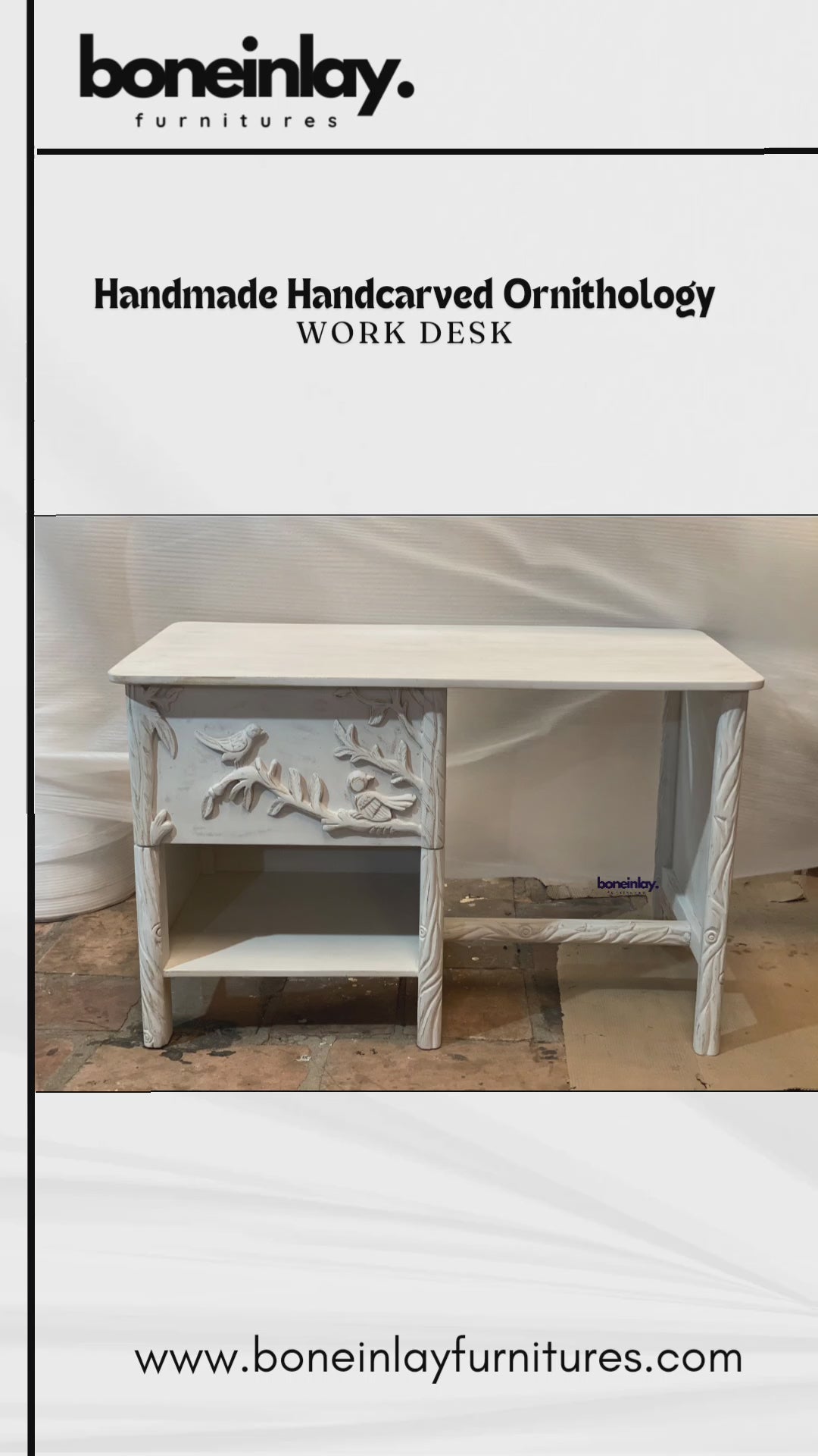 This video presents a detailed view of a handmade Ornithology Workdesk finished in a clean, vintage white. The camera highlights the intricate hand-carvings of birds resting on floral branches that decorate the single drawer front and side panels. It further showcases the desk's practical features, including a smooth tabletop, an open storage shelf, and twisted-effect carved legs