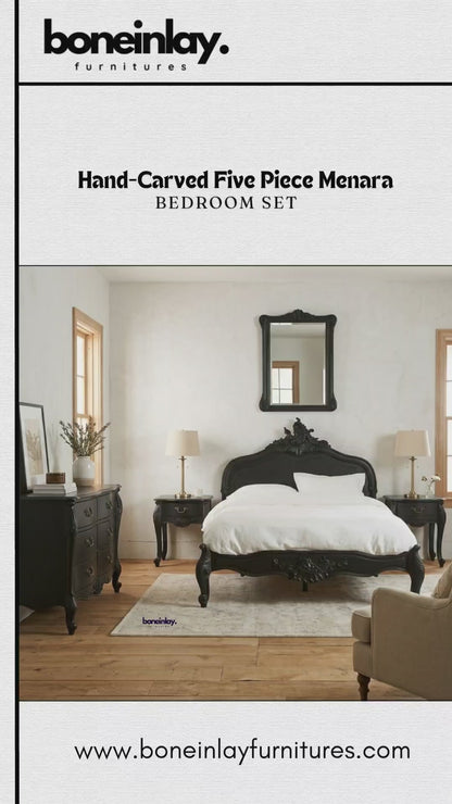 A cinematic presentation of the Hand-Carved Five-Piece Menara Bedroom Set in a sophisticated matte black finish. The collection features a majestic queen-size bed frame with an intricate, hand-sculpted Rococo-style headboard and a matching carved footboard. The set includes a grand eight-drawer double dresser with elegant curved fronts and brass-toned hardware, a coordinated hand-carved wall mirror, and two single-drawer French Provincial nightstands on classic cabriole legs. Each piece showcases high-relie