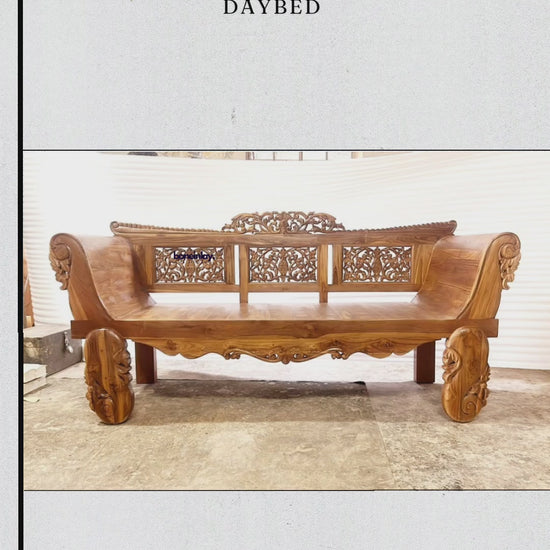 This video showcases a "Natural Hand Carved Design Solid Wooden Daybed" made from high-quality teak with a rich, organic grain. The camera pans across the extensive hand-carved details, including floral and leaf motifs on the backrest panels and side rails. Sturdy, masterfully sculpted legs and a smooth, spacious seating surface highlight the blend of traditional craftsmanship and functional luxury.