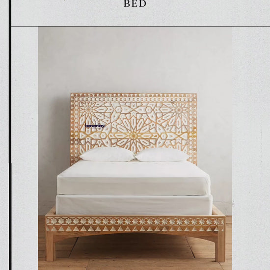 Bohemian-style platform bed with an intricate carved wooden headboard, showcasing a mix of modern minimalist structure and traditional hand-carved details