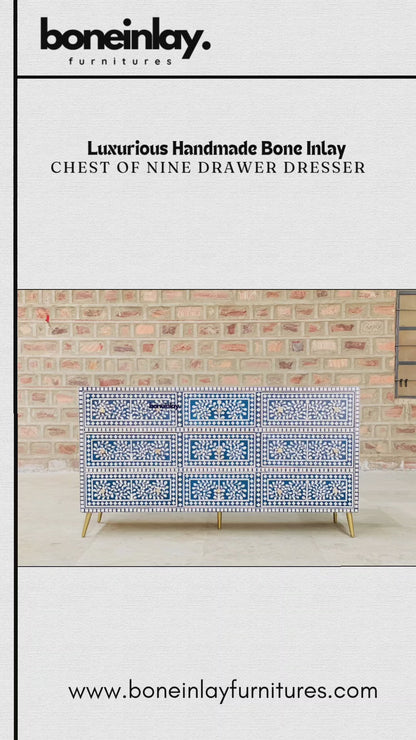 The video showcases a Luxurious Handmade Bone Inlay Chest of Nine Drawers. It features an intricate floral and leaf pattern in white against a deep blue background, accented with elegant gold-finished hardware and tapered legs. The clip highlights the artistry of the piece, showing a drawer opening to reveal a vibrant blue interior. It concludes with information on worldwide delivery and customization options available at boneinlayfurnitures.com.