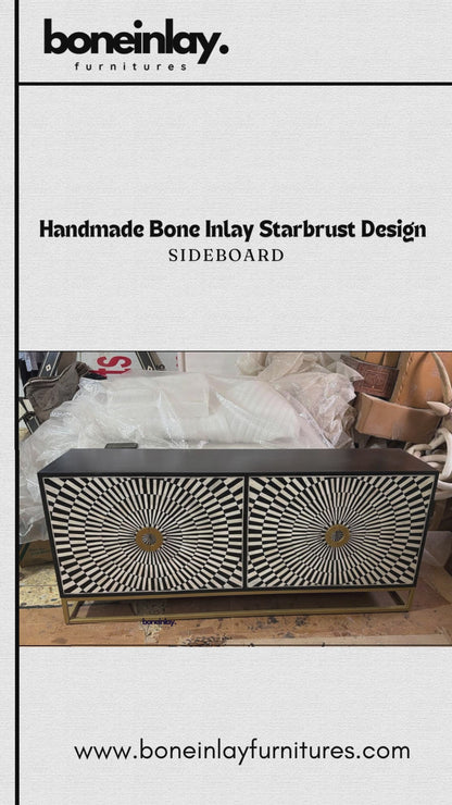 his "Handmade Bone Inlay Starburst Design Sideboard" features a striking, high-contrast geometric optical illusion pattern of radiating black and white tiles across its two cabinet doors. The center of each starburst is detailed with a large, decorative gold metallic circular ring handle that coordinates with the minimalist gold open frame base. The sideboard's clean-lined frame is finished in solid black, balancing its bold, graphic face with modern sophistication.