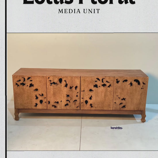 
This video highlights a natural solid wood media unit featuring intricate, hand-carved lotus floral openwork across its four cabinet doors. A hand demonstrates the seamless functionality of the magnetic cabinet closures, revealing a spacious interior shelf perfect for storage. The unit is elevated by short, classic wooden legs, blending traditional organic design with modern home utility.