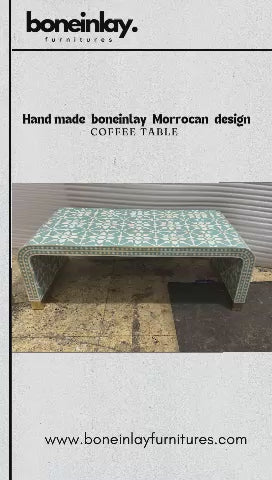 This video showcases an elegant, handmade Moroccan-design bone inlay coffee table in a vibrant mint green and white color palette. The table features a modern waterfall edge (curved sides) and is adorned with an intricate geometric star-shaped inlay pattern.
