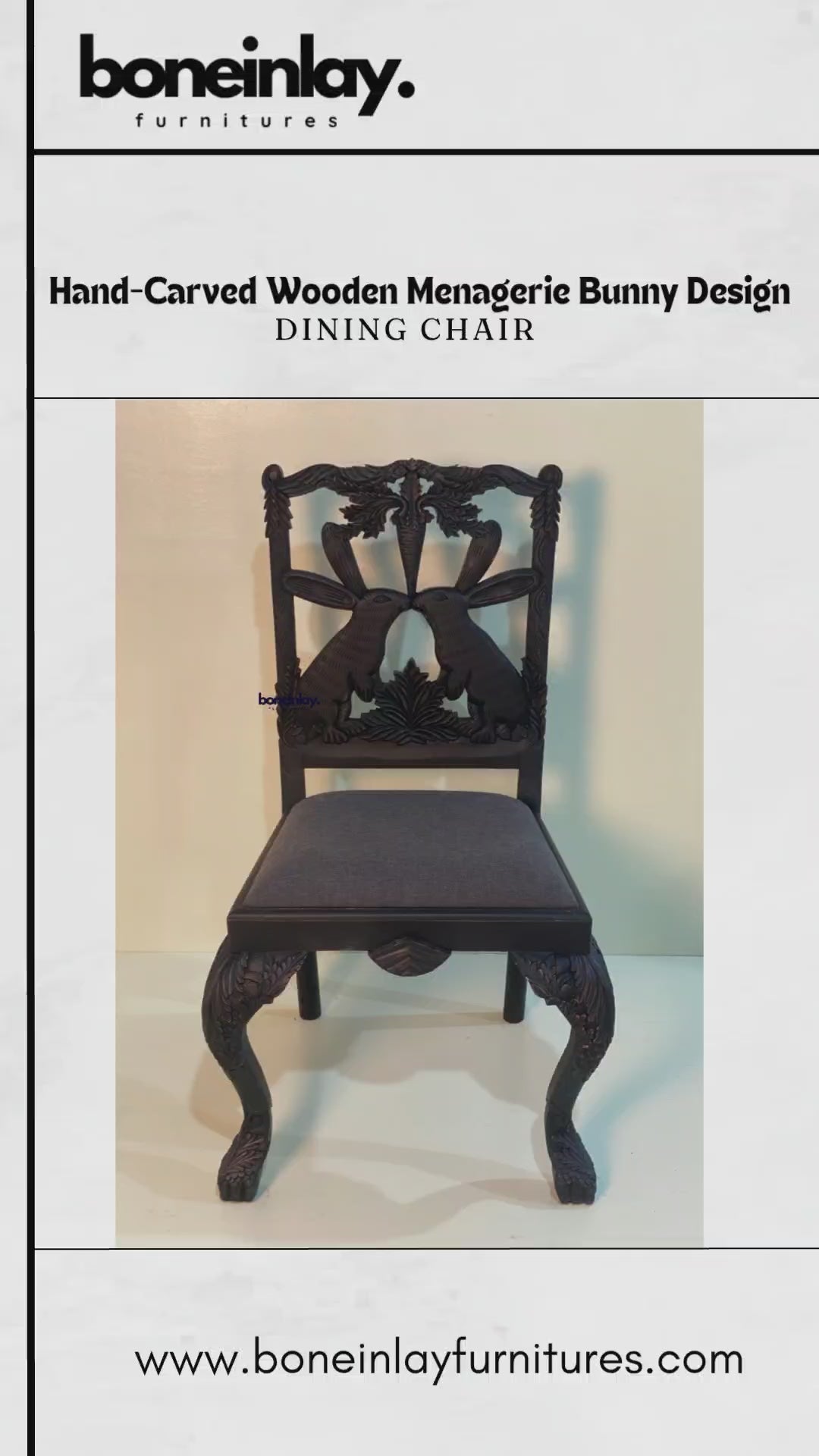 Close-up of a black "Menagerie Bunny" dining chair showcasing detailed hand-carving on the backrest and legs. The chair features a dark charcoal upholstered seat and a whimsical, symmetrical bunny and carrot design carved from solid wood.