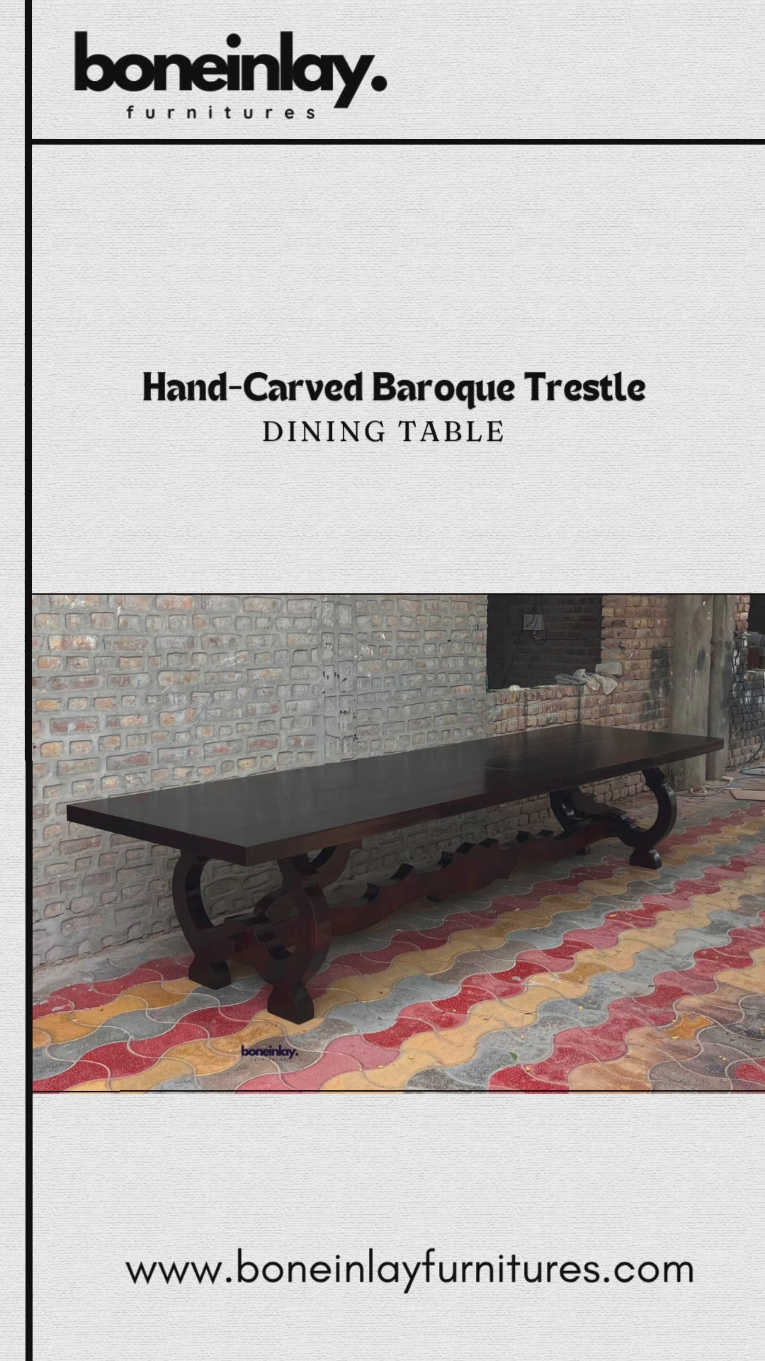 A promotional video showcases a Hand-Carved Baroque Trestle Dining Table, featuring a dark-stained wood finish and an intricately designed base. The clip frames the elongated table from multiple angles in an outdoor space before transitioning to a staged dining room setting, where it is surrounded by elegant chairs under a chandelier.