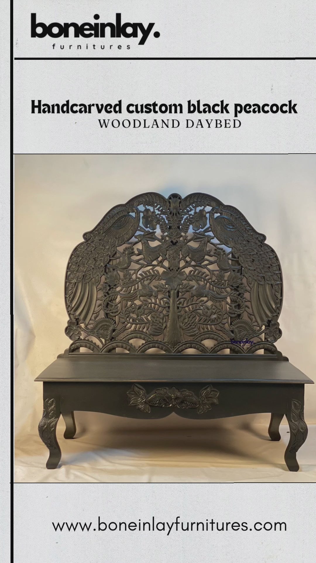 This video showcases a "Handcarved Custom Black Peacock Woodland Daybed," an exquisite piece of furniture featuring a tall, arched backrest with detailed openwork carvings of peacocks, floral patterns, and nature motifs. The entire piece is finished in a bold matte black, creating a dramatic and sophisticated aesthetic. The camera highlights the artistry of the hand-carved details, from the crown of the backrest down to the floral-carved apron and curved legs, blending traditional craftsmanship with a moder